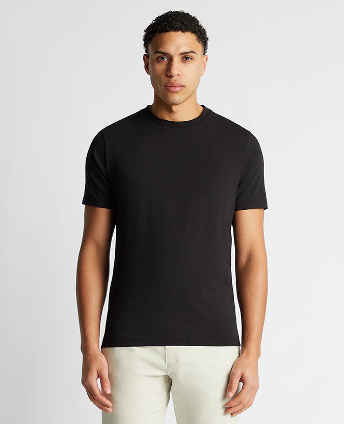 Man wearing a black Relaxed Fit Crew Neck Tencel T-Shirt