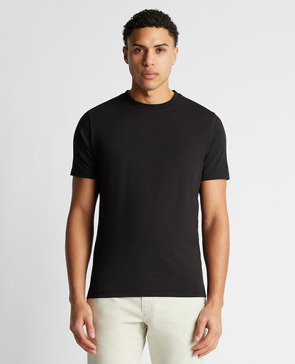 Man wearing a black Relaxed Fit Crew Neck Tencel T-Shirt