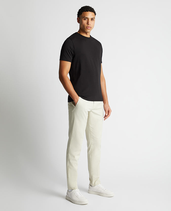 Man wearing a black Relaxed Fit Crew Neck Tencel T-Shirt