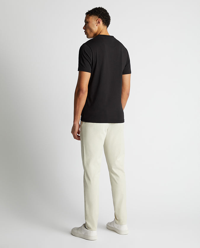 Man wearing a black Relaxed Fit Crew Neck Tencel T-Shirt