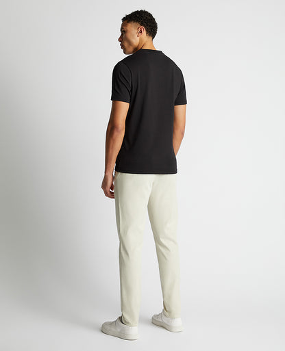 Man wearing a black Relaxed Fit Crew Neck Tencel T-Shirt