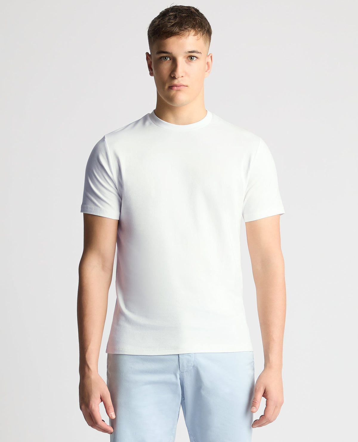 Man wearing a white Relaxed Fit Crew Neck Tencel T-Shirt
