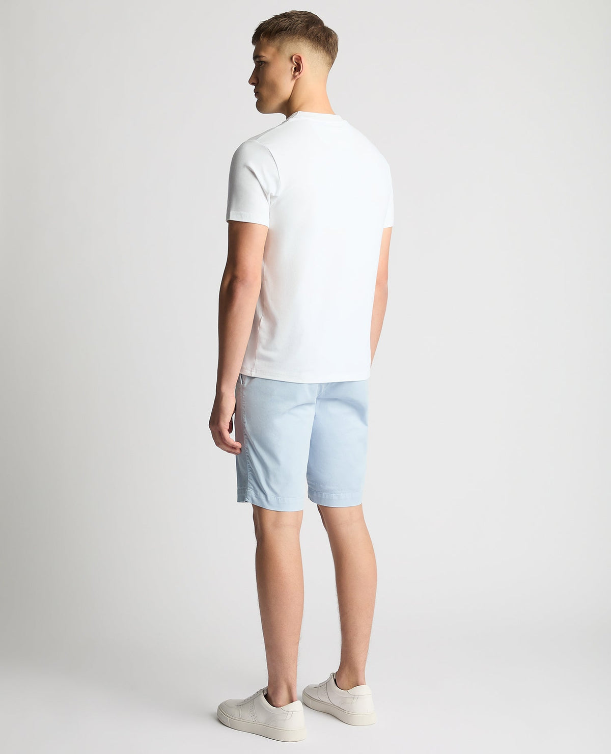 Man wearing a white Relaxed Fit Crew Neck Tencel T-Shirt