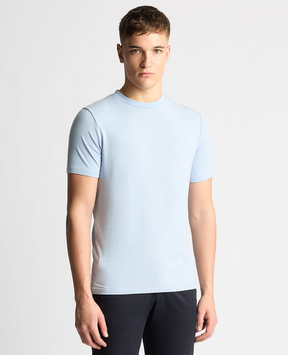 Man wearing a blue Relaxed Fit Crew Neck Tencel T-Shirt