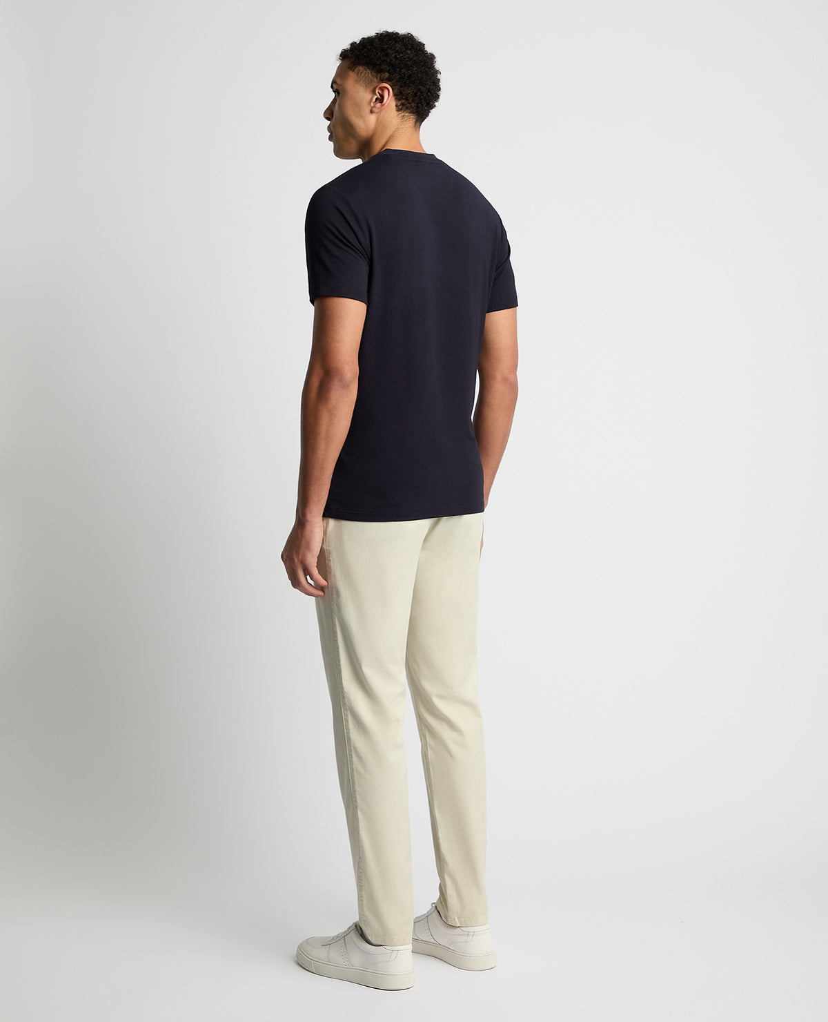 Man wearing a navy Relaxed Fit Crew Neck Tencel T-Shirt