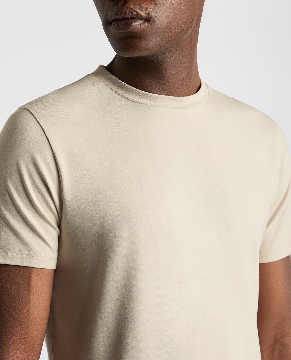 Man wearing a sand Relaxed Fit Crew Neck Tencel T-Shirt