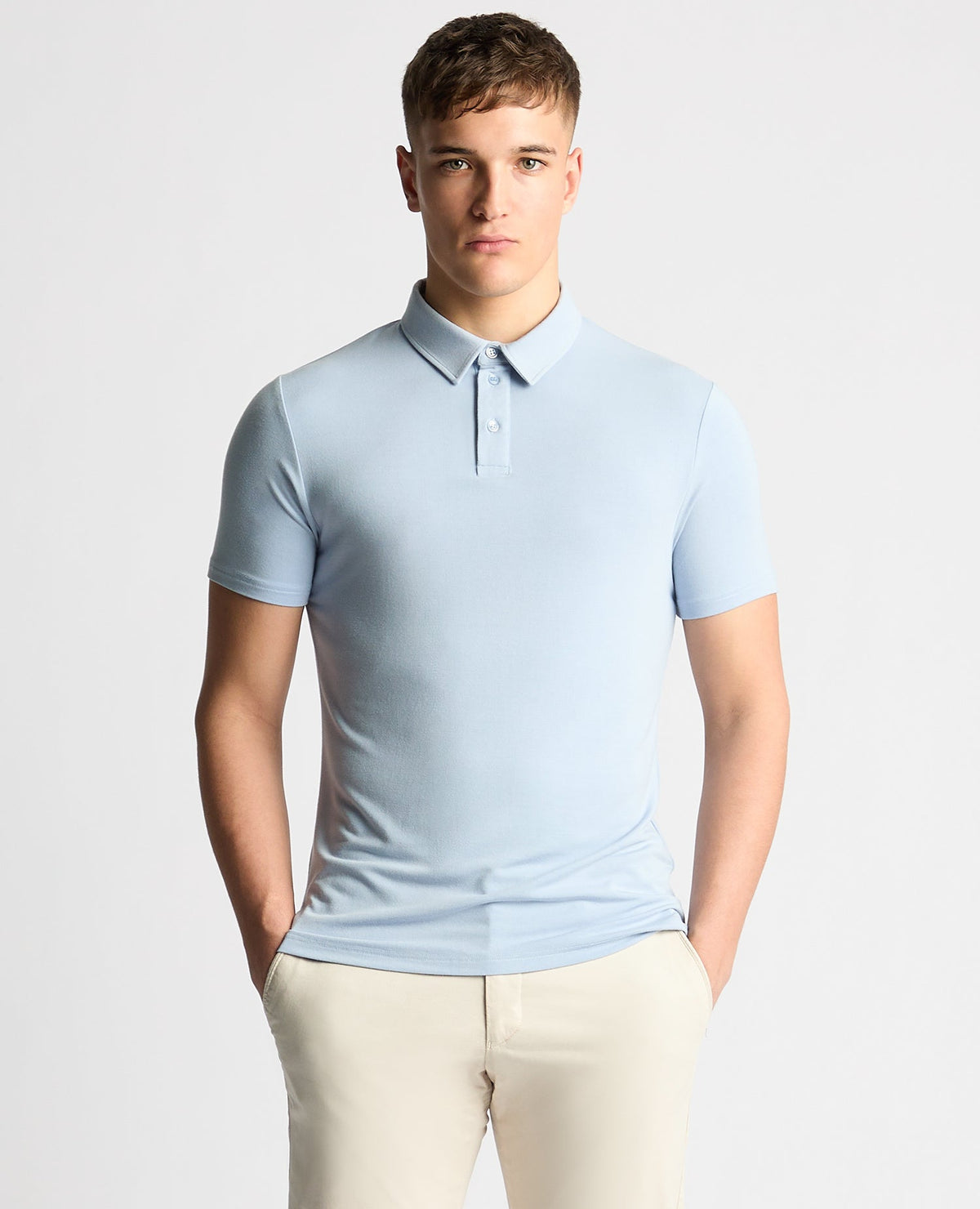 Man wearing a blue Relaxed Fit Tencel Polo