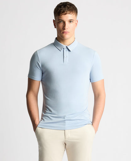 Man wearing a blue Relaxed Fit Tencel Polo