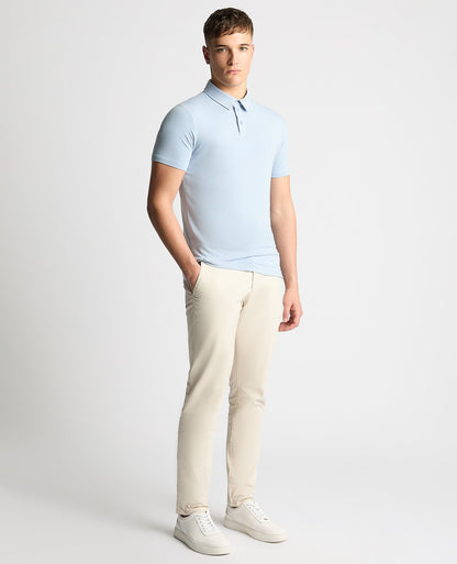 Man wearing a blue Relaxed Fit Tencel Polo