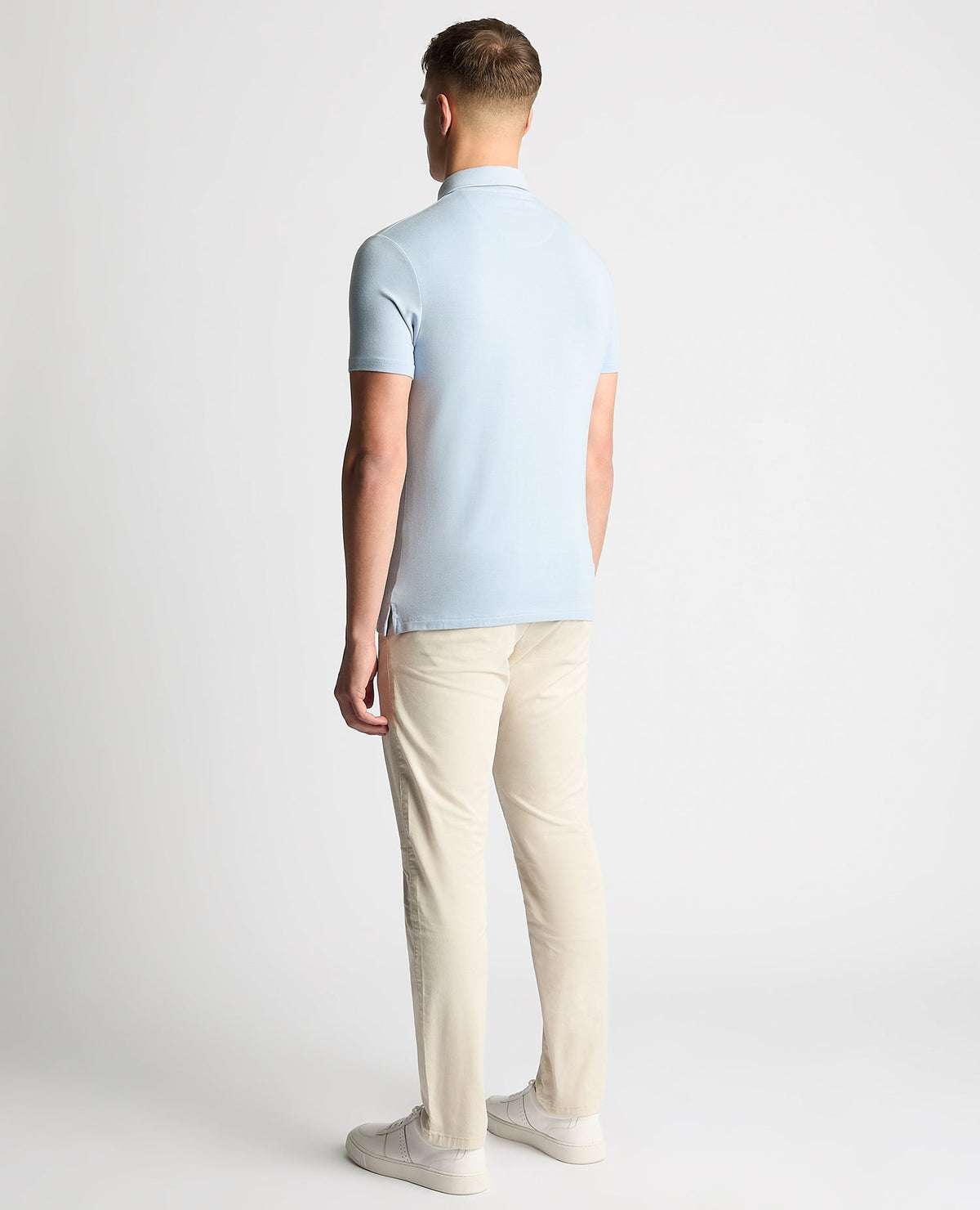Man wearing a blue Relaxed Fit Tencel Polo