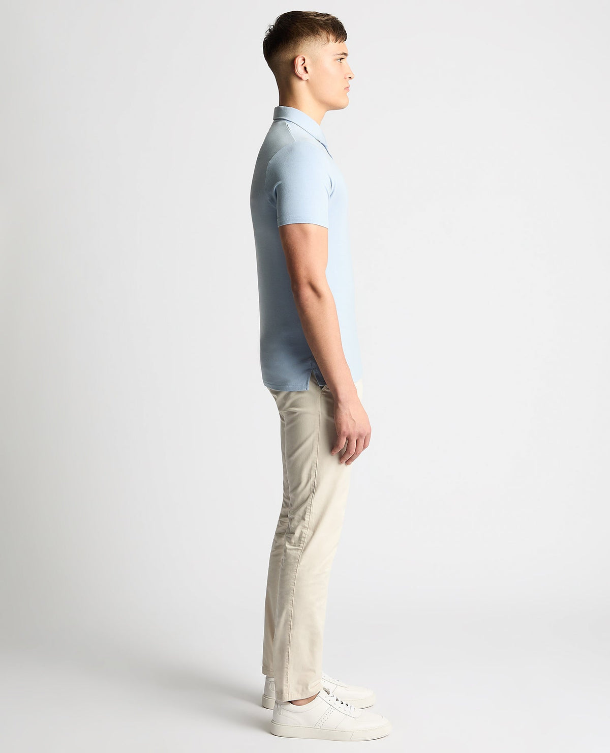 Man wearing a blue Relaxed Fit Tencel Polo