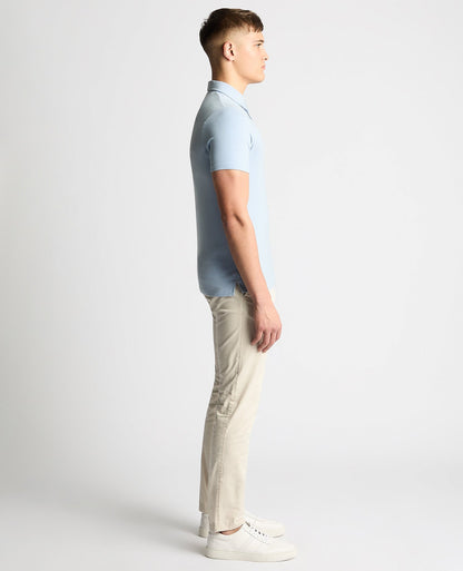 Man wearing a blue Relaxed Fit Tencel Polo