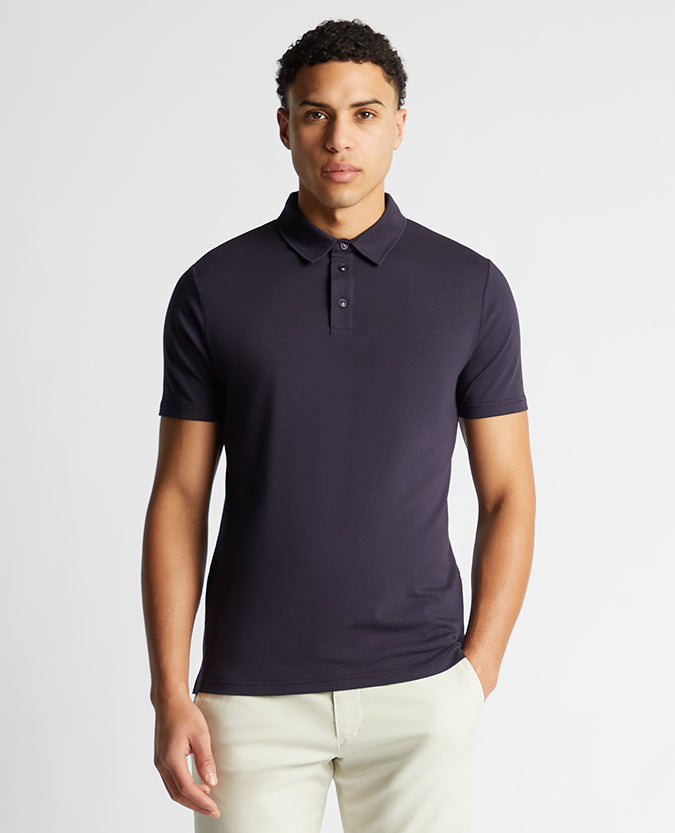 Man wearing a navy Relaxed Fit Tencel Polo