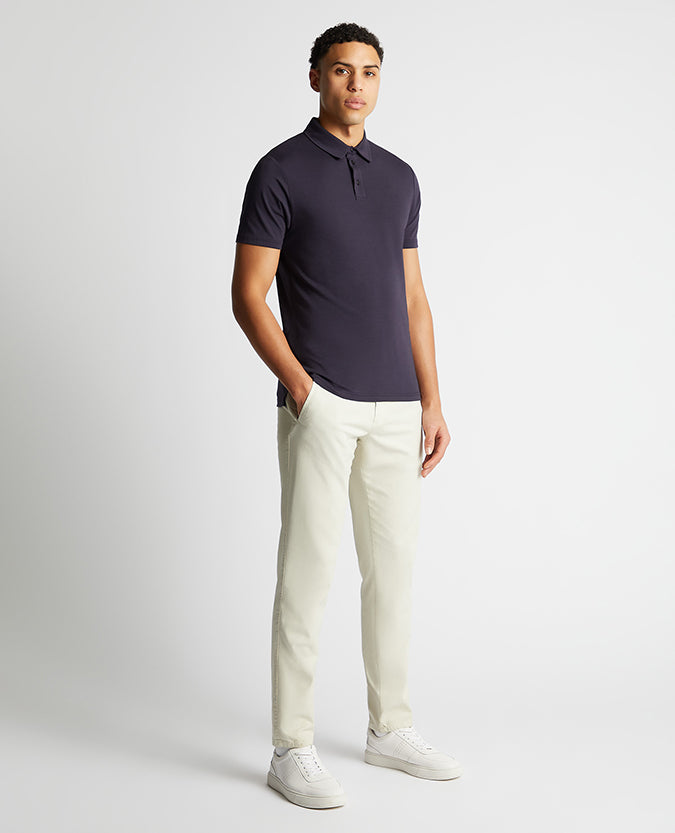 Man wearing a navy Relaxed Fit Tencel Polo