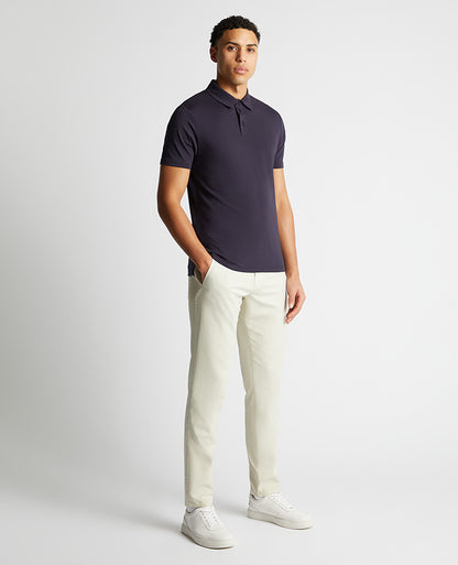 Man wearing a navy Relaxed Fit Tencel Polo