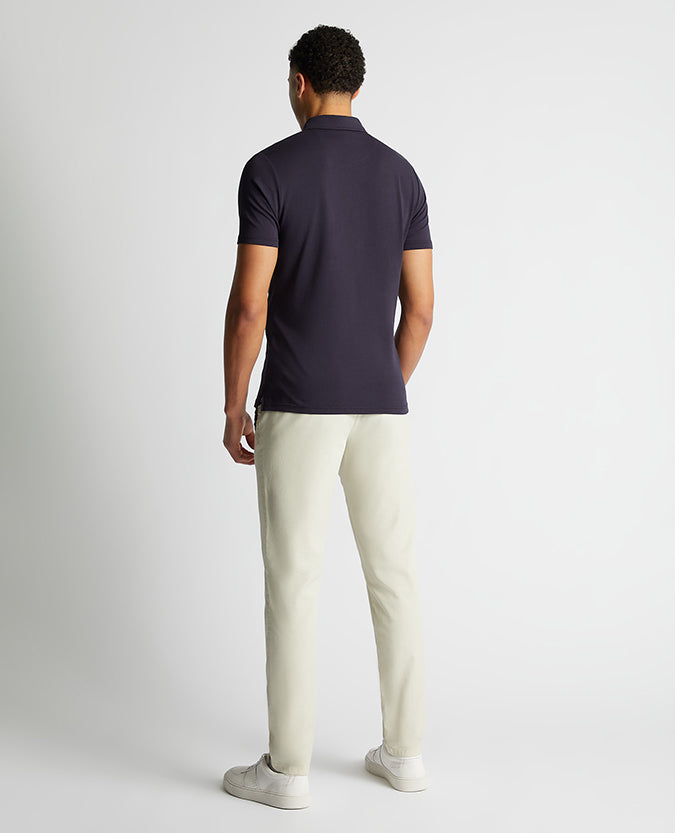 Man wearing a navy Relaxed Fit Tencel Polo