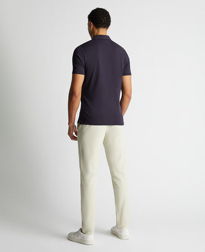 Man wearing a navy Relaxed Fit Tencel Polo