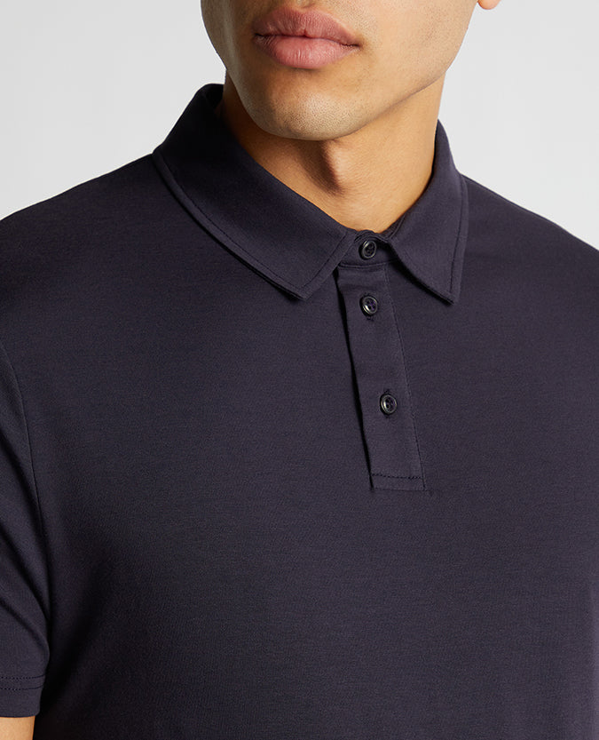 Man wearing a navy Relaxed Fit Tencel Polo