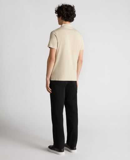 Man wearing a sand Relaxed Fit Tencel Polo