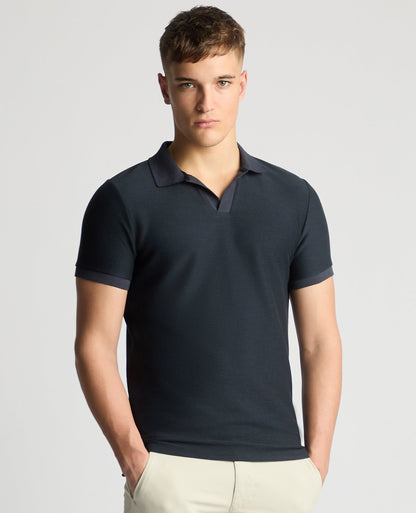 Man wearing a navy Tapered Fit Open Collar Polo