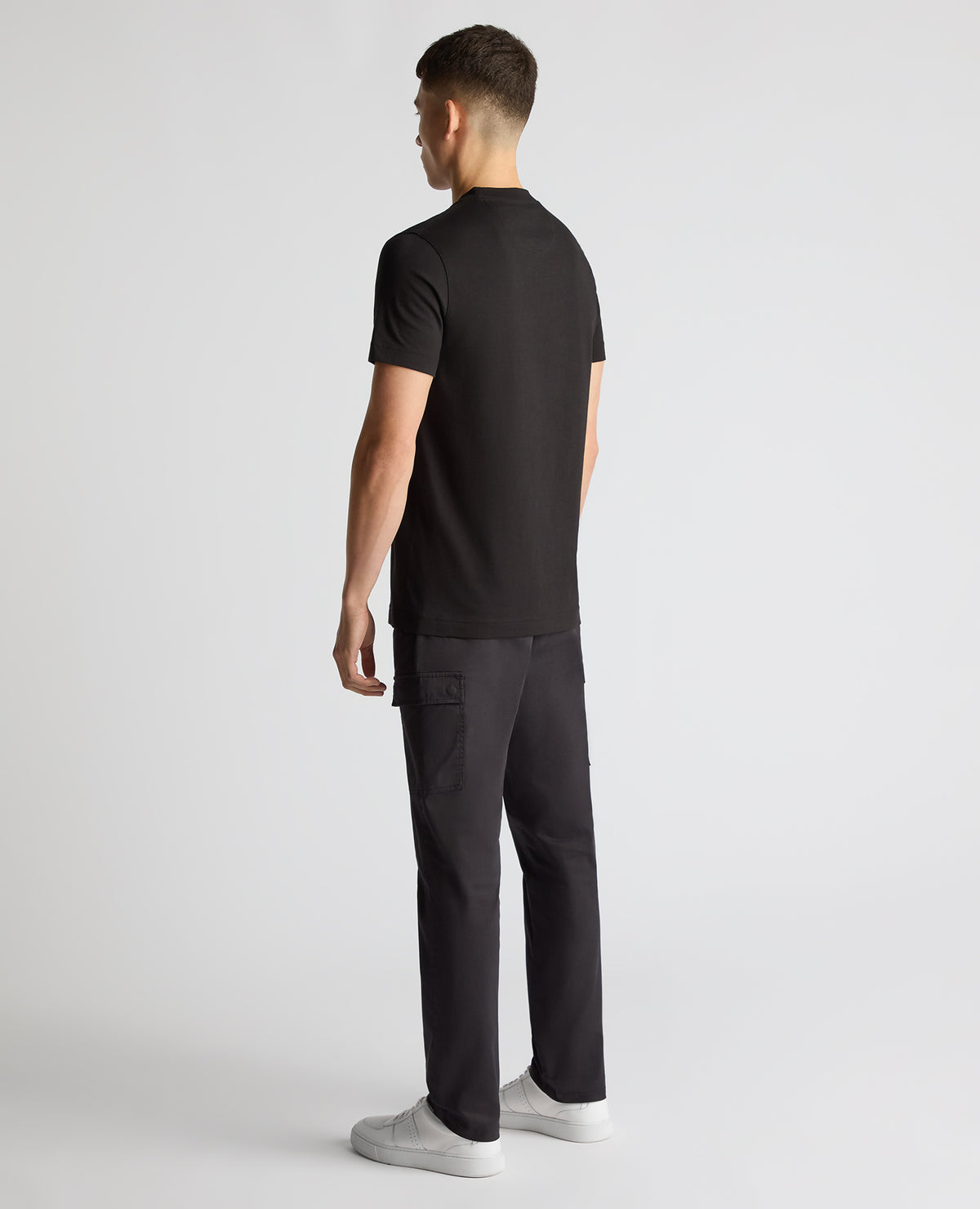 Man wearing a black Regular Fit Organic Cotton T-Shirt