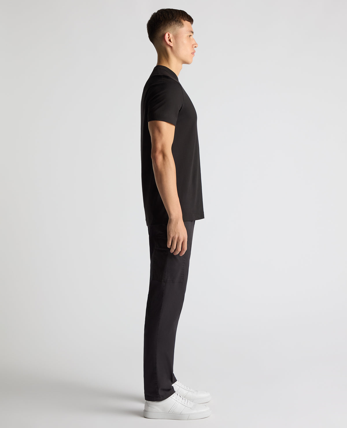 Man wearing a black Regular Fit Organic Cotton T-Shirt