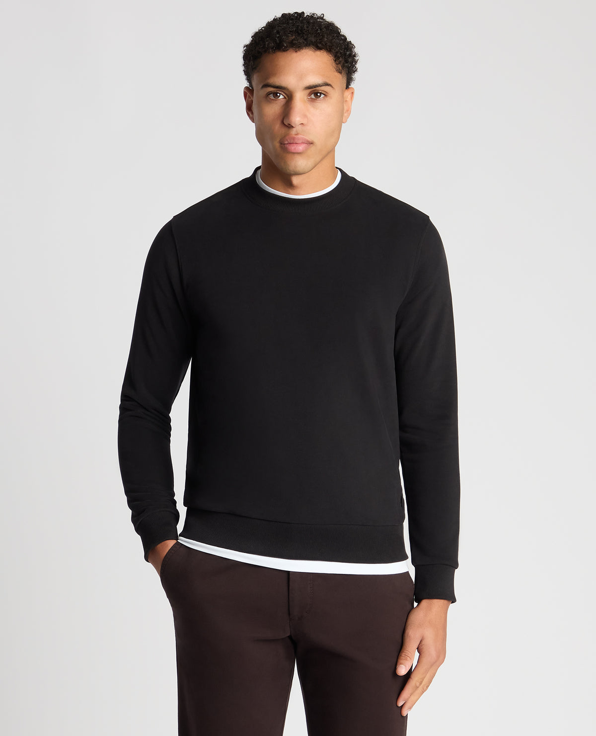 Man wearing a black Tapered Fit Soft Touch Cotton-Blend Sweatshirt