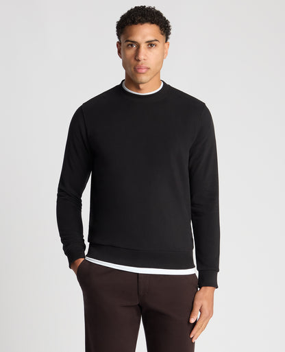 Man wearing a black Tapered Fit Soft Touch Cotton-Blend Sweatshirt