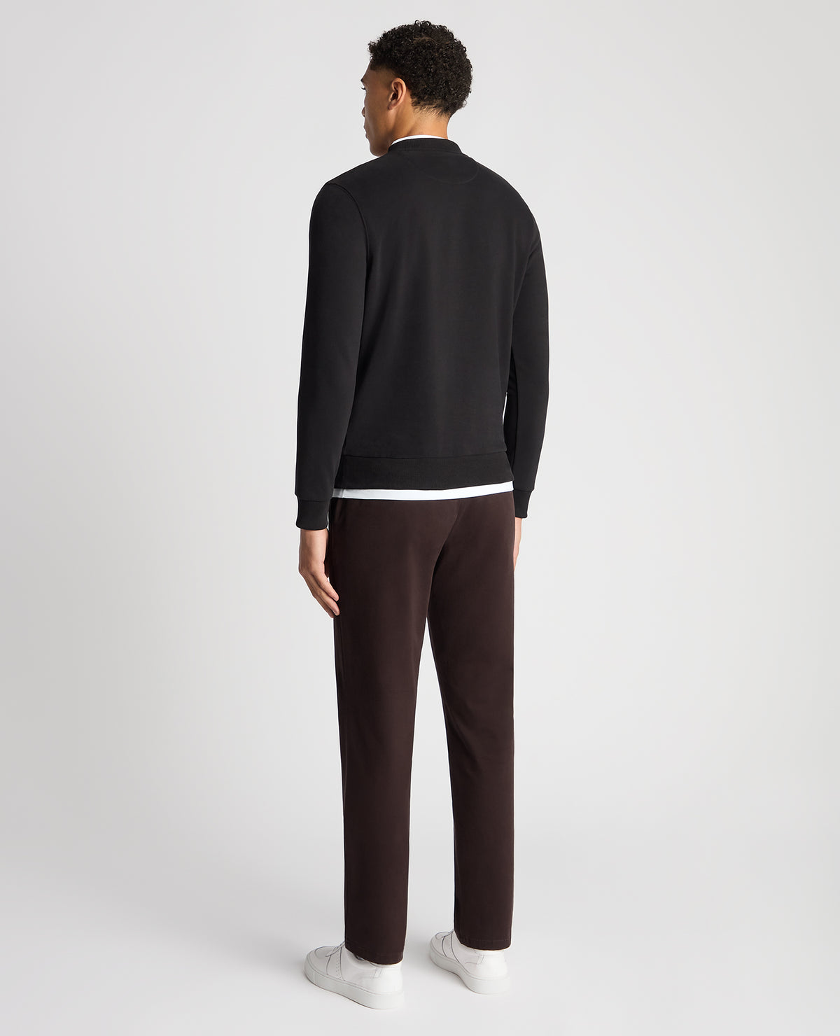 Man wearing a black Tapered Fit Soft Touch Cotton-Blend Sweatshirt