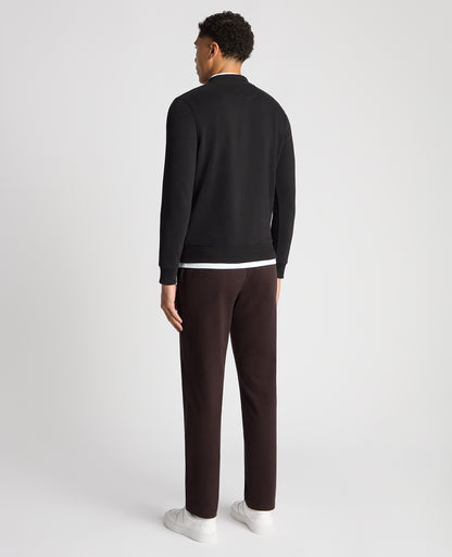 Man wearing a black Tapered Fit Soft Touch Cotton-Blend Sweatshirt