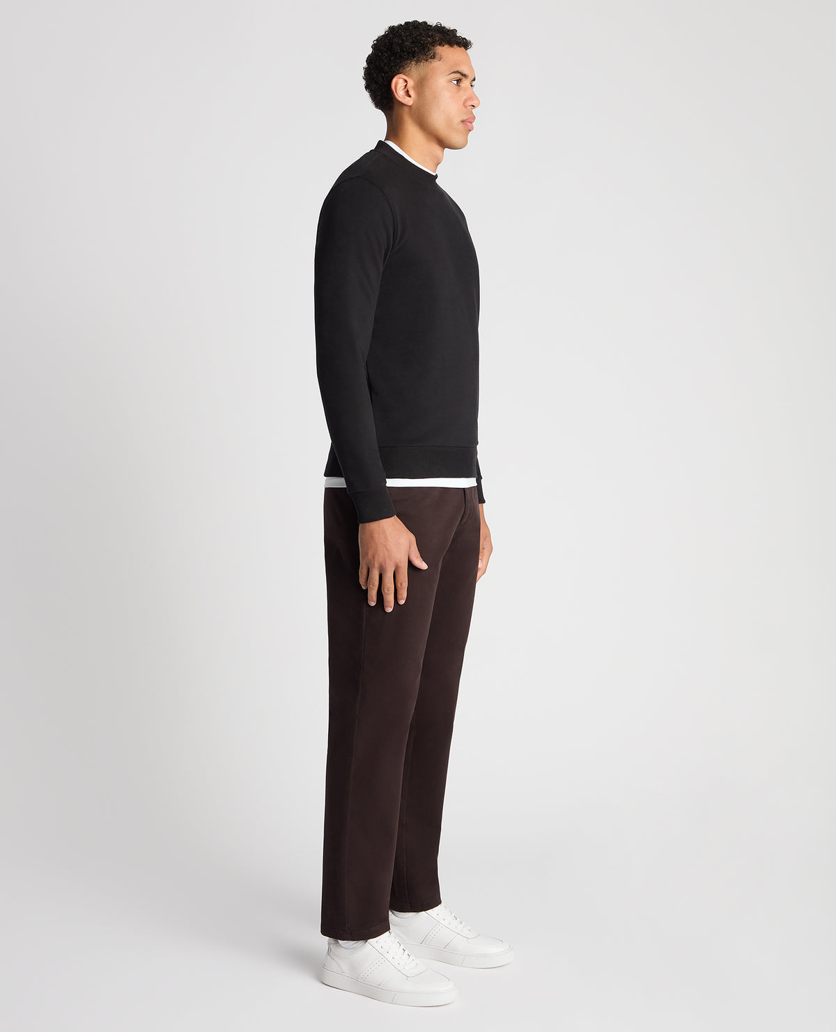 Man wearing a black Tapered Fit Soft Touch Cotton-Blend Sweatshirt