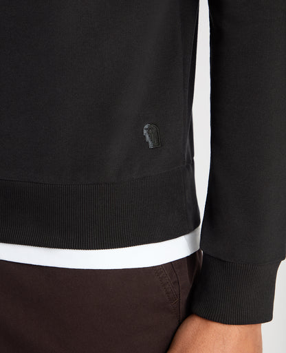 Man wearing a black Tapered Fit Soft Touch Cotton-Blend Sweatshirt