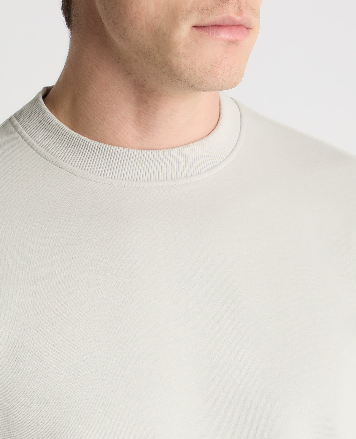 Man wearing a Grey jumper