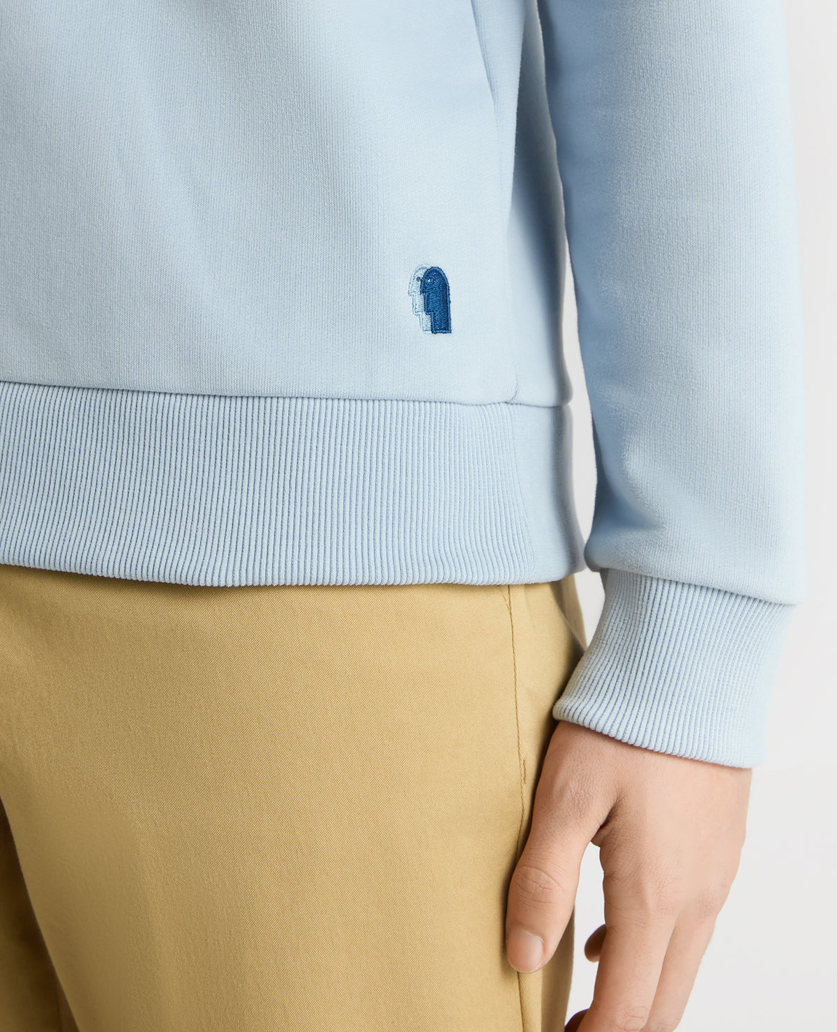 Man wearing a blue Tapered Fit Soft Touch Cotton-Blend Sweatshirt