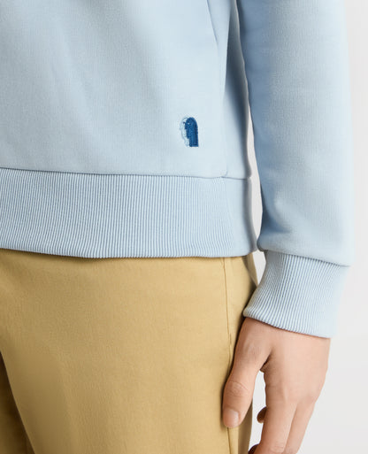 Man wearing a blue Tapered Fit Soft Touch Cotton-Blend Sweatshirt