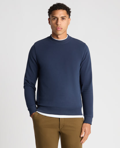 Man wearing a blue Tapered Fit Soft Touch Cotton-Blend Sweatshirt