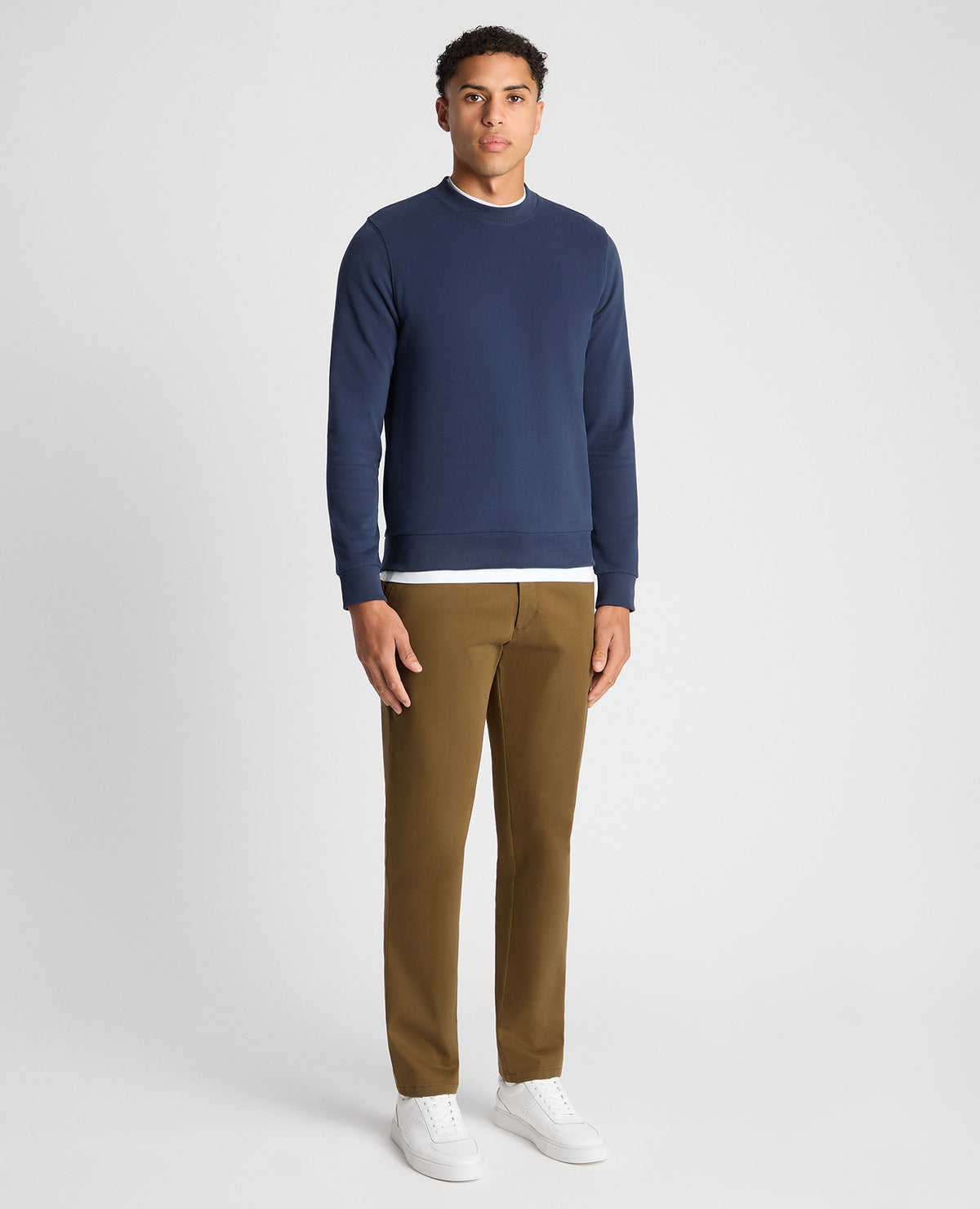 Man wearing a blue Tapered Fit Soft Touch Cotton-Blend Sweatshirt