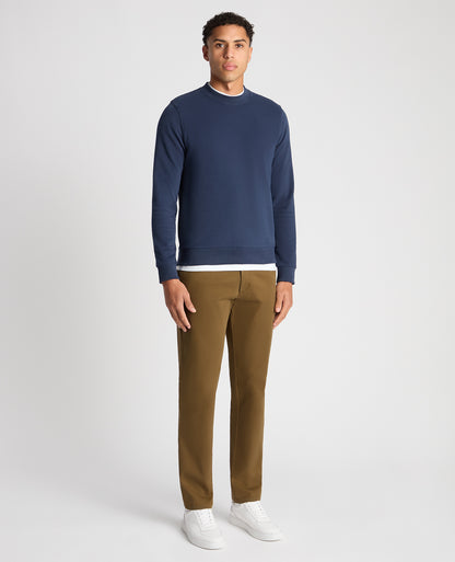 Man wearing a blue Tapered Fit Soft Touch Cotton-Blend Sweatshirt
