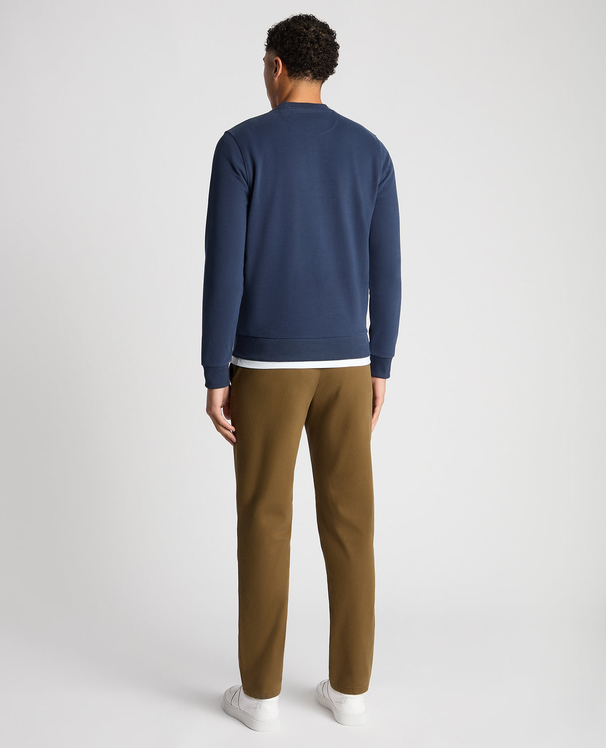 Man wearing a blue Tapered Fit Soft Touch Cotton-Blend Sweatshirt