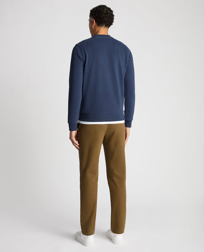 Man wearing a blue Tapered Fit Soft Touch Cotton-Blend Sweatshirt