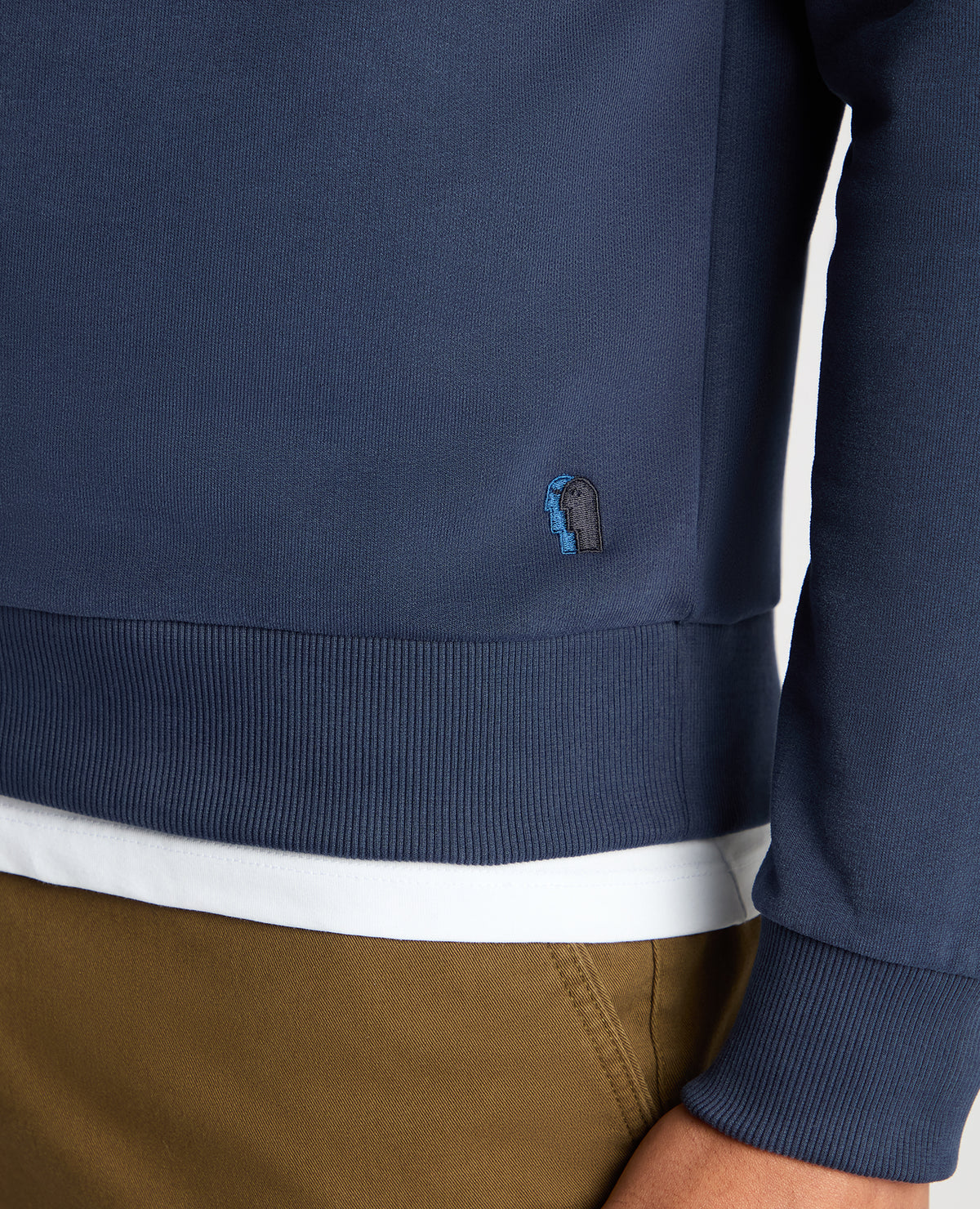 Man wearing a blue Tapered Fit Soft Touch Cotton-Blend Sweatshirt