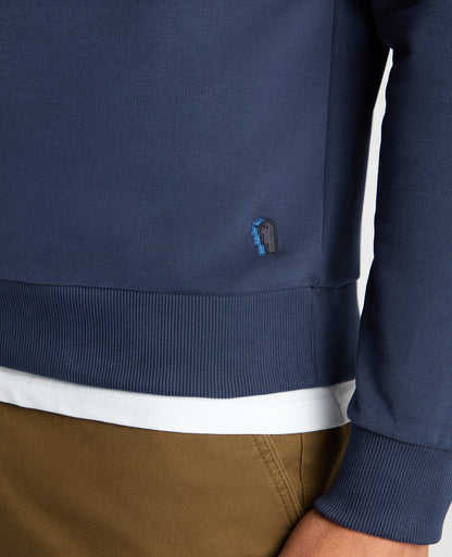 Man wearing a blue Tapered Fit Soft Touch Cotton-Blend Sweatshirt
