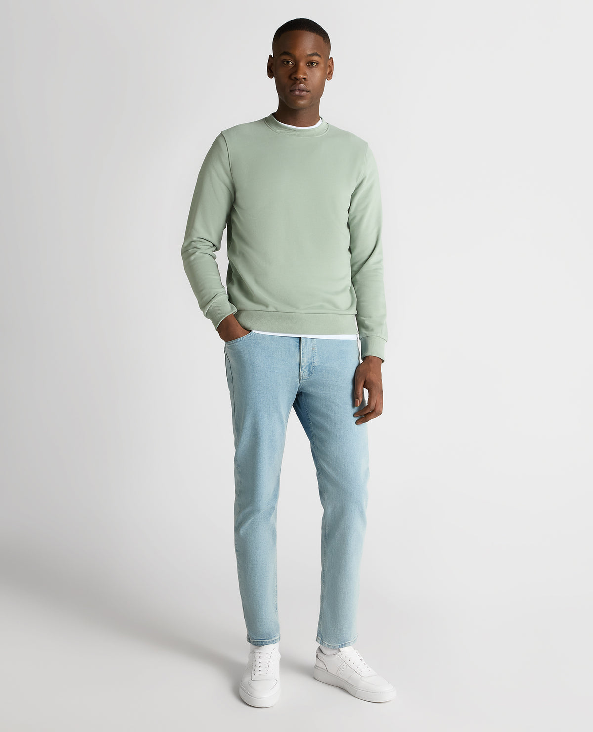 Man wearing a green Tapered Fit Soft Touch Cotton-Blend Sweatshirt