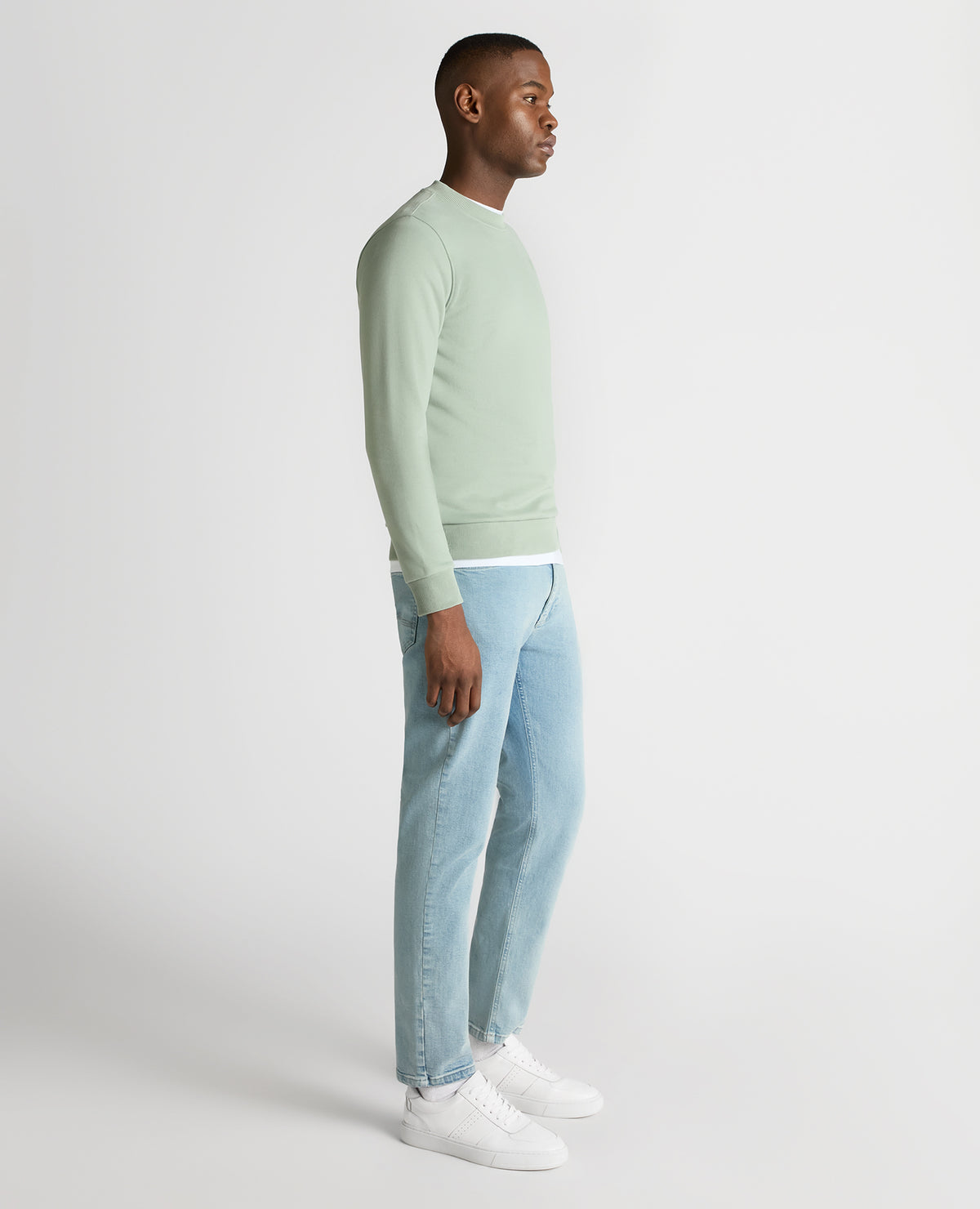 Man wearing a green Tapered Fit Soft Touch Cotton-Blend Sweatshirt