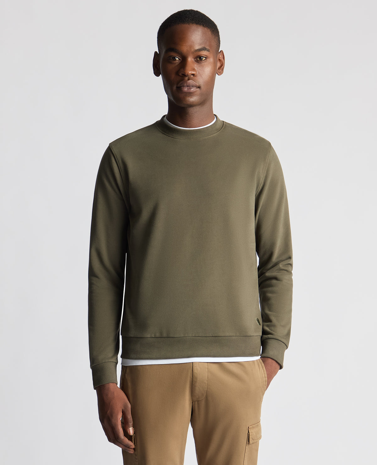 Man wearing a green Tapered Fit Soft Touch Cotton-Blend Sweatshirt