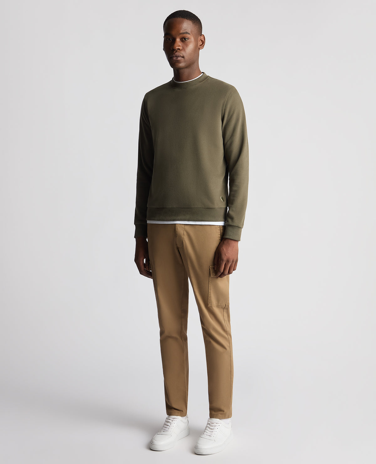 Man wearing a green Tapered Fit Soft Touch Cotton-Blend Sweatshirt