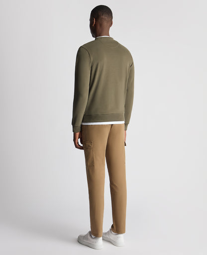 Man wearing a green Tapered Fit Soft Touch Cotton-Blend Sweatshirt