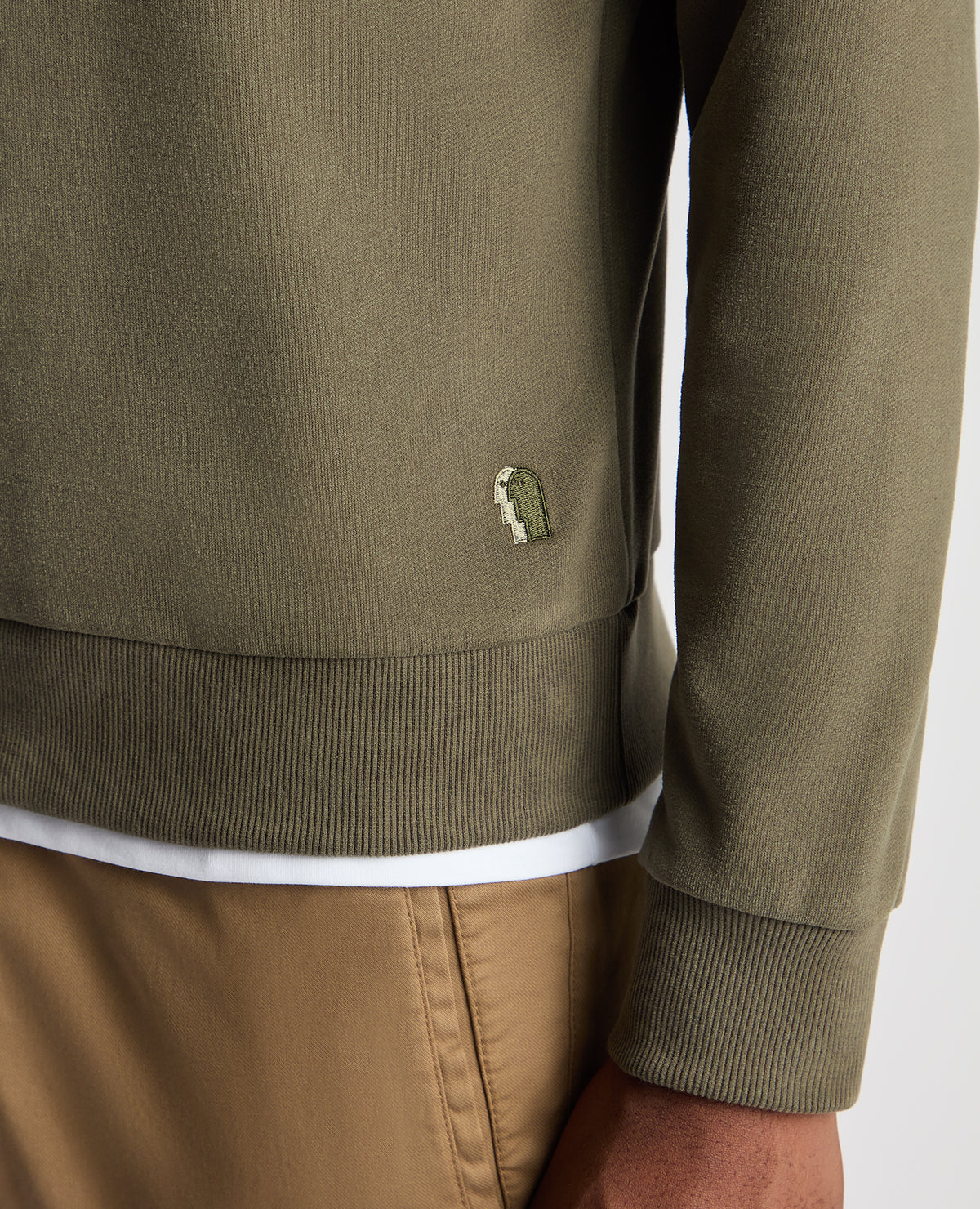 Man wearing a green Tapered Fit Soft Touch Cotton-Blend Sweatshirt