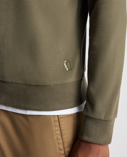 Man wearing a green Tapered Fit Soft Touch Cotton-Blend Sweatshirt