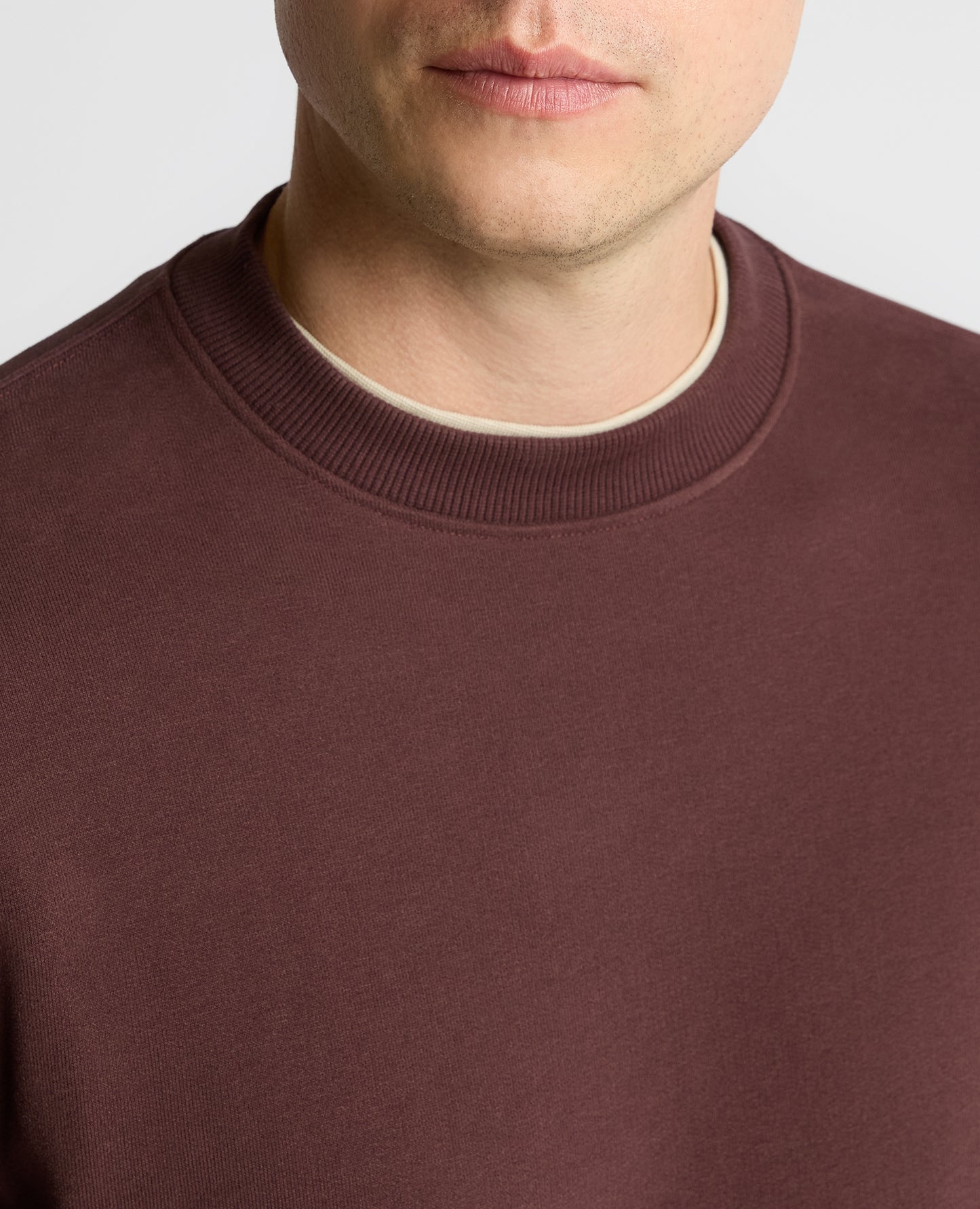 Man wearing a brown Crew Neck Terry Sweatshirt